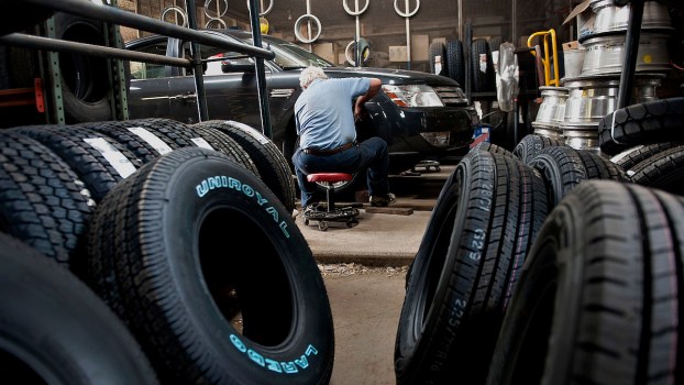 A car being maintained where people have to worry about maintenance costs.