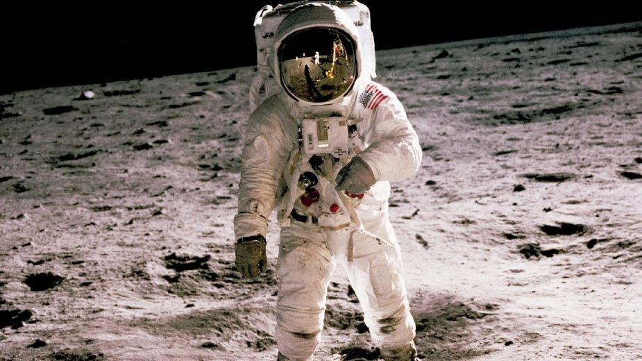 Apollo 11 astronaut on lunar surface, highlighting NASA warning of China claiming moon if it beats US in space race