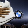 A BMW logo, which is amoung one the most reliable luxury cars.