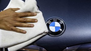 A BMW logo, which is amoung one the most reliable luxury cars.