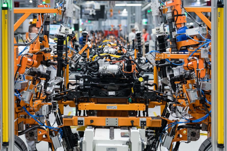 An electric car being assembled in VW factory.