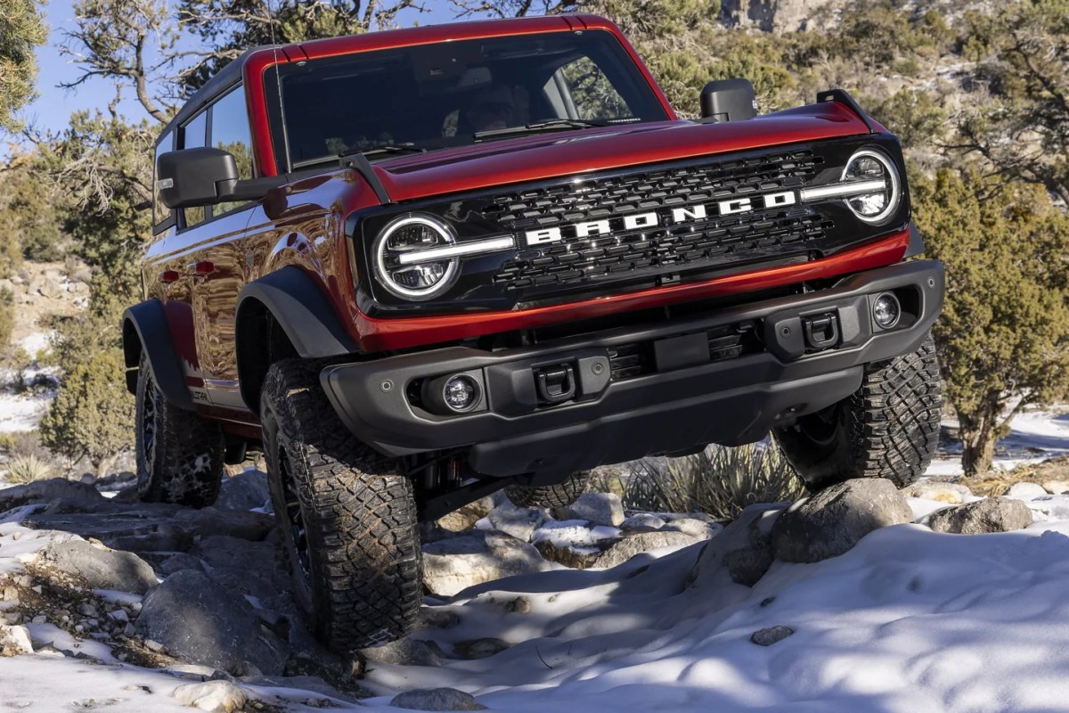 2022 Ford Bronco Wildtrak driving off-road through the snow, it's worth over $50,000