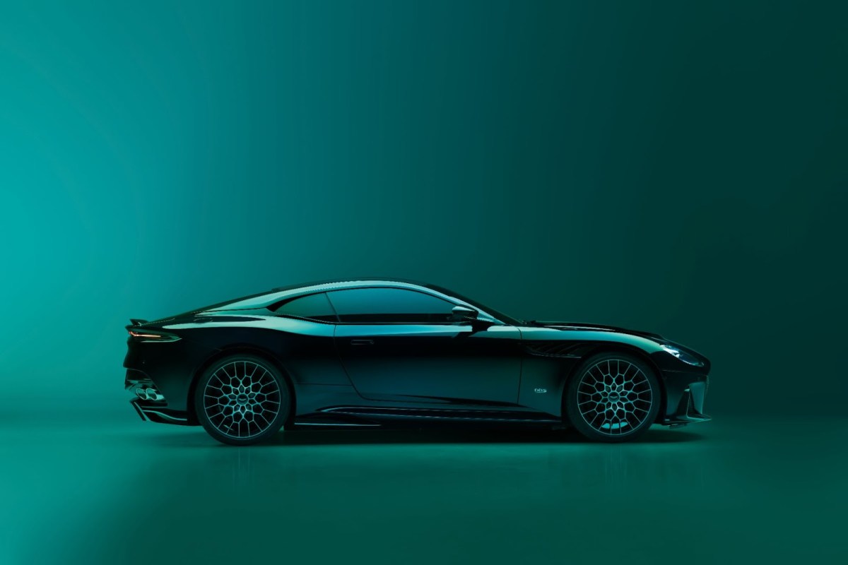 The Aston Martin DBS 770 Ultimate in profile on a British Racing Green studio background