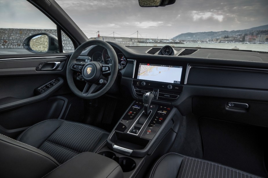 Dashboard in 2023 Porsche Macan, most affordable new Porsche car and best Car and Driver compact luxury SUV