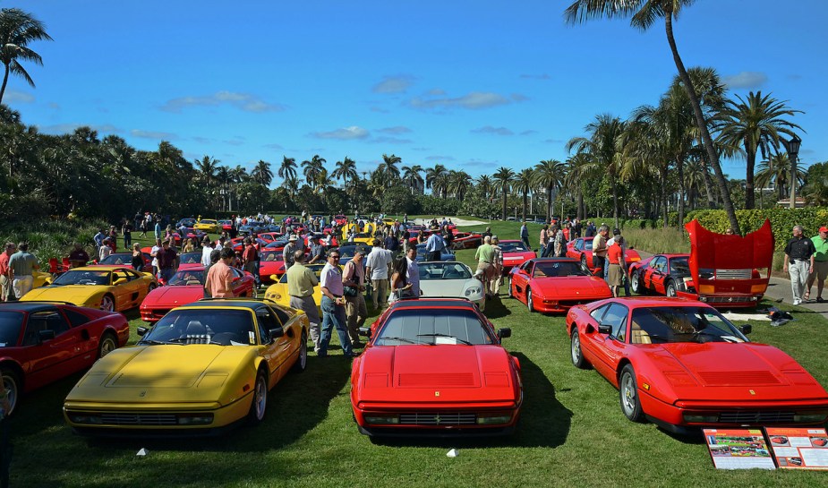 An array of Ferraris, including a front row of 328 GTB models is seen on the front lawn.