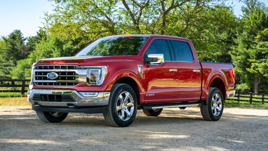 A red Ford F-150 parked outdoors where Ford F-150 insurance costs could be important.