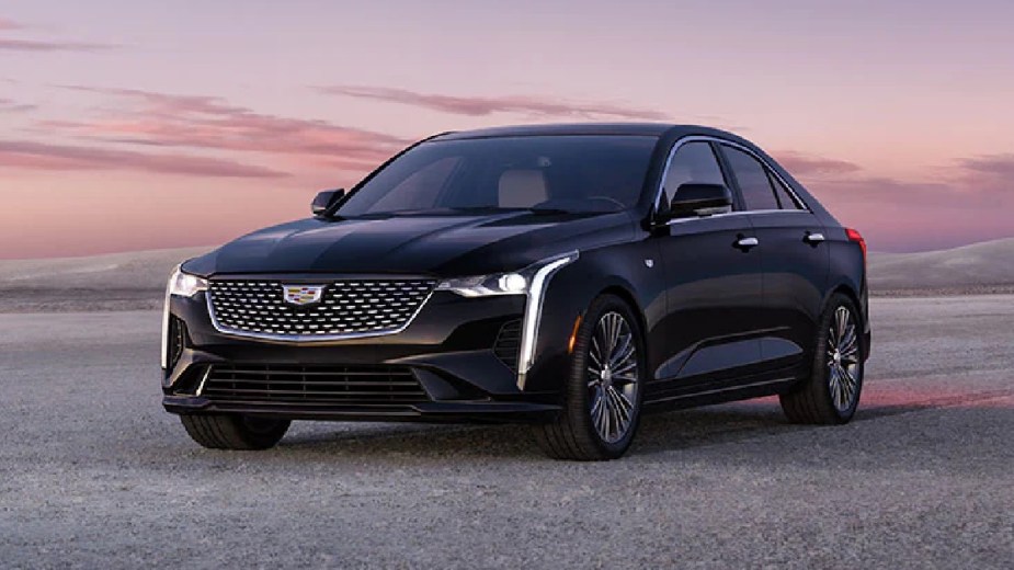 Front angle view of black 2023 Cadillac CT4, cheapest new Cadillac model and a luxury car bargain 
