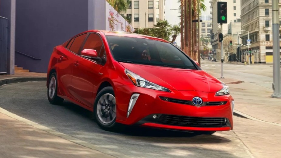Front angle view of red 2022 Toyota Prius, Consumer Reports reliable car, showing why Toyota cars are so reliable