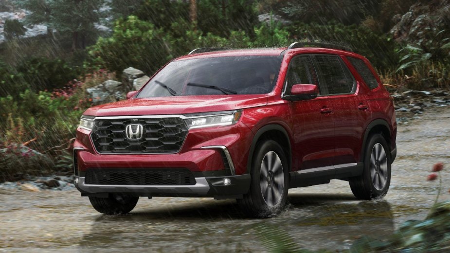 Front angle view of red 2023 Honda Pilot midsize SUV