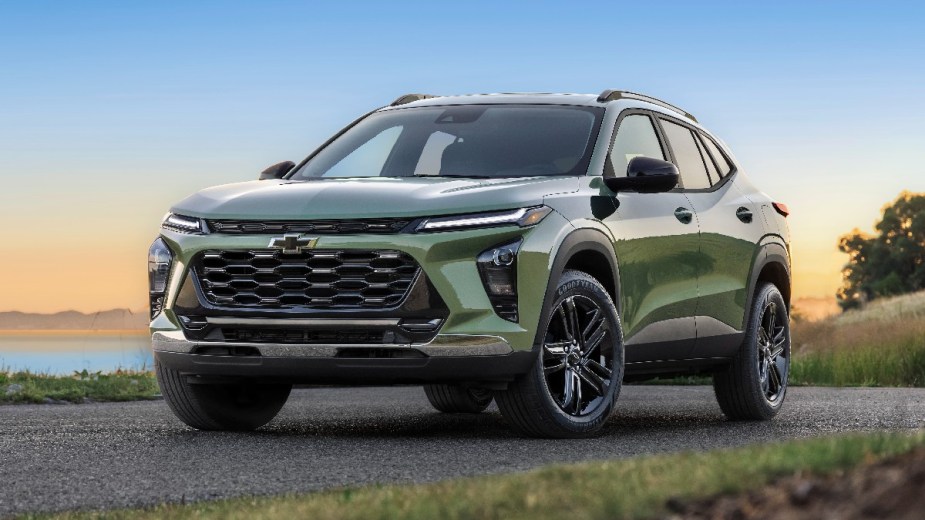 Front angle view of redesigned green 2024 Chevy Trax small SUV, the cheapest new Chevrolet car