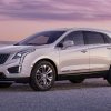 Front angle view of white 2023 Cadillac XT5 luxury SUV, only new Cadillac model recommended by Consumer Reports in 2023