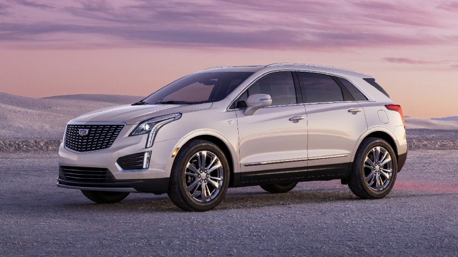 Front angle view of white 2023 Cadillac XT5 luxury SUV, only new Cadillac model recommended by Consumer Reports in 2023