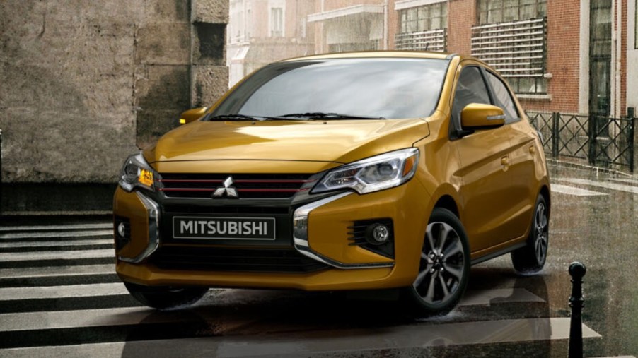 Front angle view of yellow 2023 Mitsubishi Mirage subcompact, cheapest Mitsubishi and one of most affordable cars in US