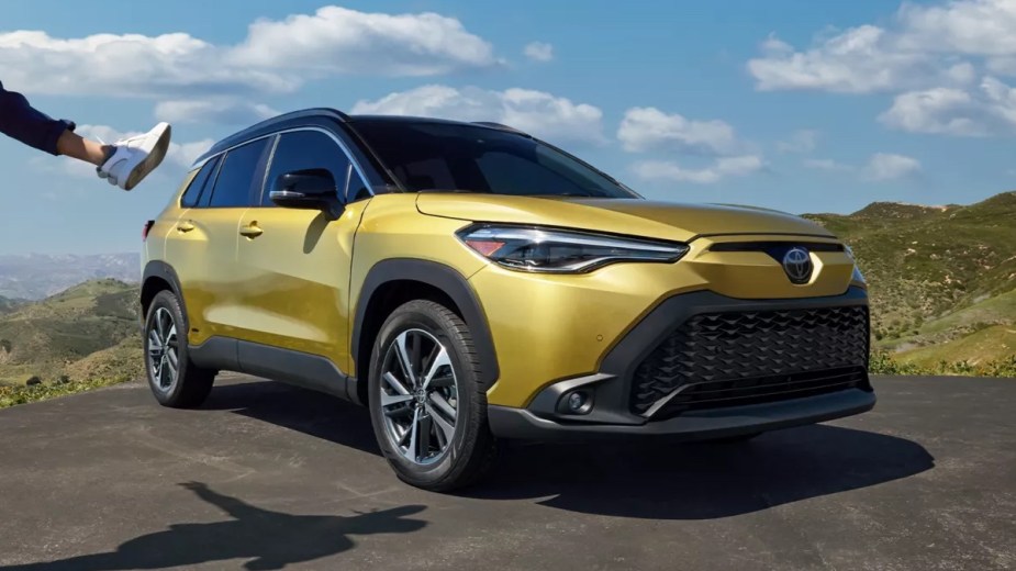 Front view of yellow 2023 Toyota Corolla Cross Hybrid crossover SUV