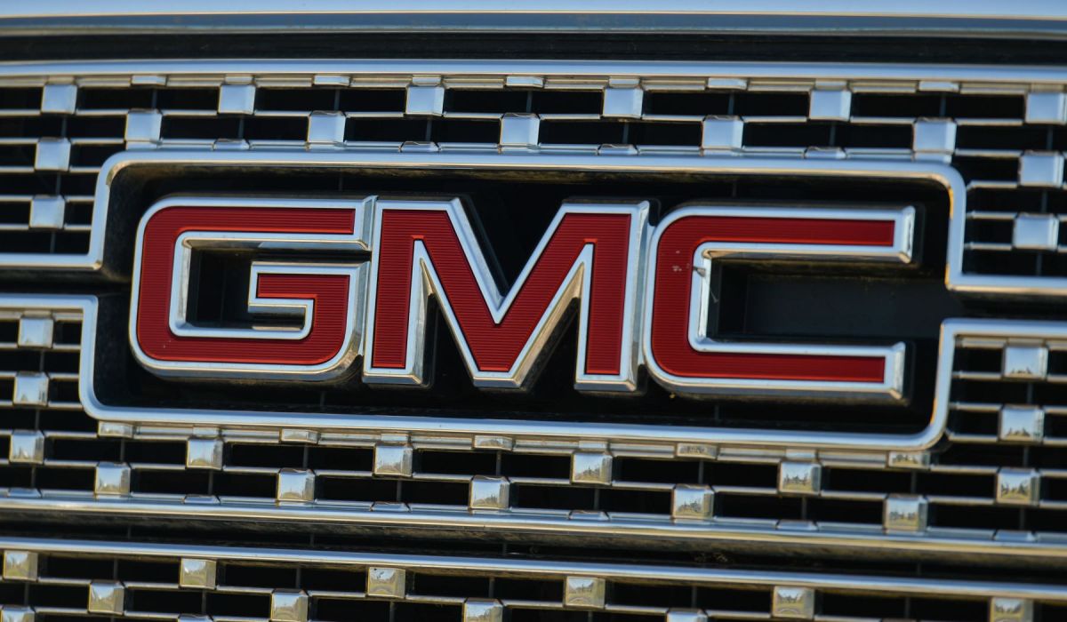 The GMC logo on a truck model at a GMC dealership in South Edmonton, Alberta, Canada