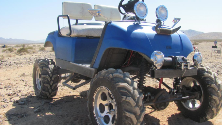 off-road golf cart in the dirt. How much do you have to spend to get a good golf cart?