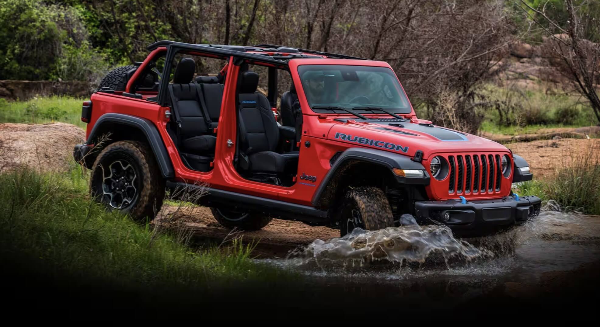 The Jeep Wrangler fording water while off-roading