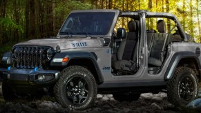 A gray 2023 Jeep Wrangler 4xe small electric SUV is parked.