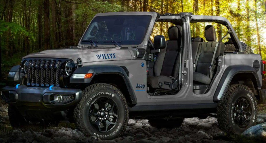 A gray 2023 Jeep Wrangler 4xe small electric SUV is parked.