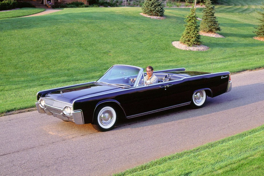 A black Lincoln Continental, an iconic land yacht before we had big trucks.