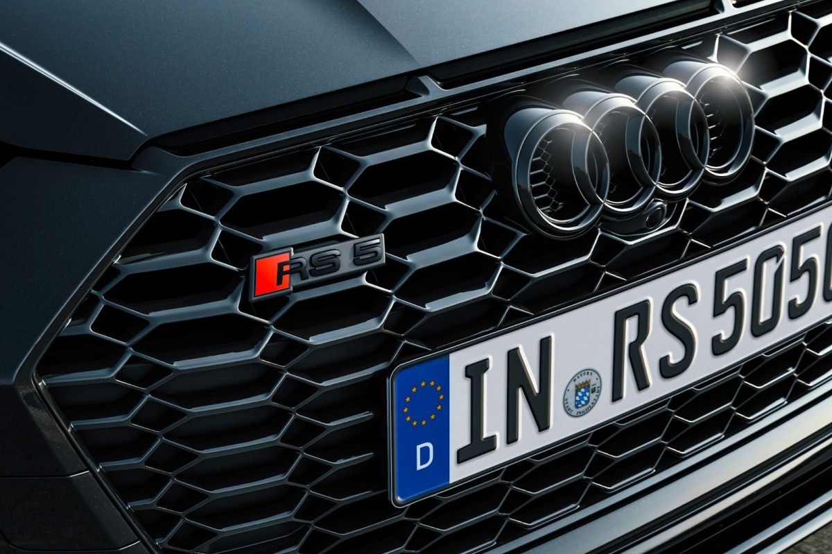A close-up of the Audi RS 5 Competition grille badge
