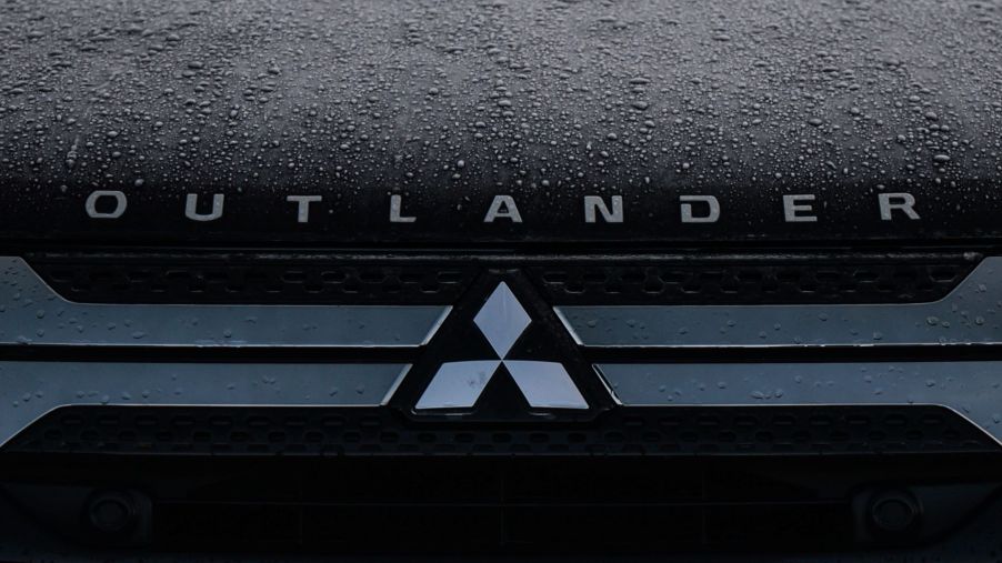 The hood of a Mitsubishi Outlander SUV model covered in rain in Dublin, Ireland