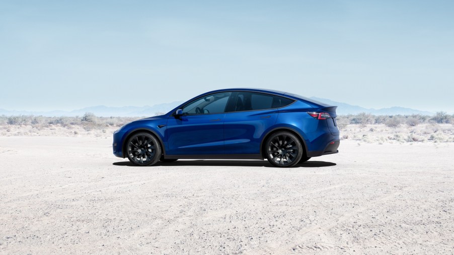 A 2022 Tesla Model Y used its bright blue paint to contrast with the sand in the bright desert.