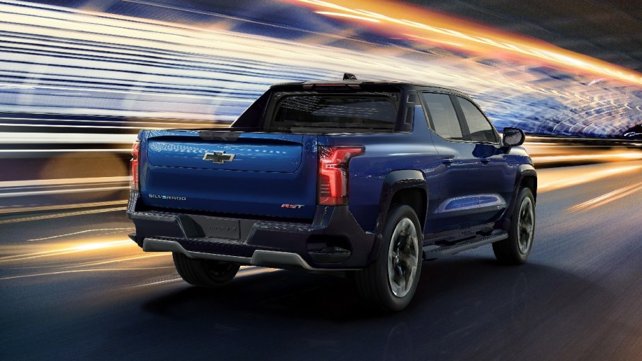 Rear angle view of blue Chevy Silverado EV, highlighting new Chevy small electric pickup truck to top the Ford Maverick 