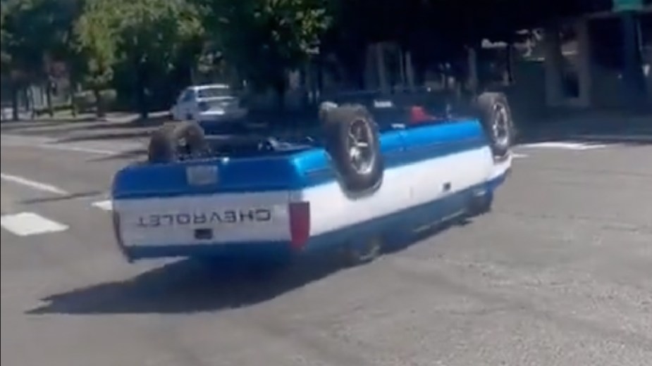 Rear angle view of upside-down Chevy pickup truck in video that’s gone viral on Twitter