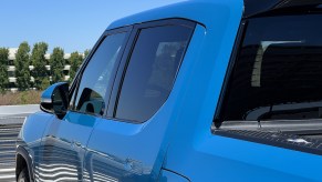 A blue Rivian R1T, which is one of the best electric trucks.