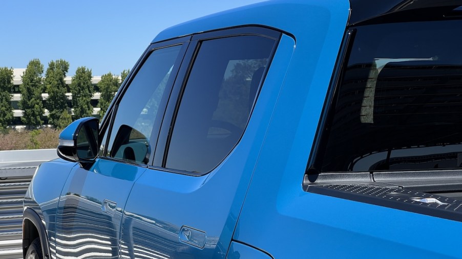 A blue Rivian R1T, which is one of the best electric trucks.