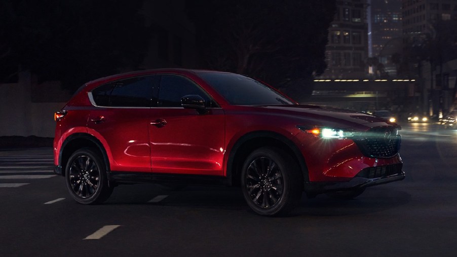Side view of red 2023 Mazda CX-5 crossover SUV