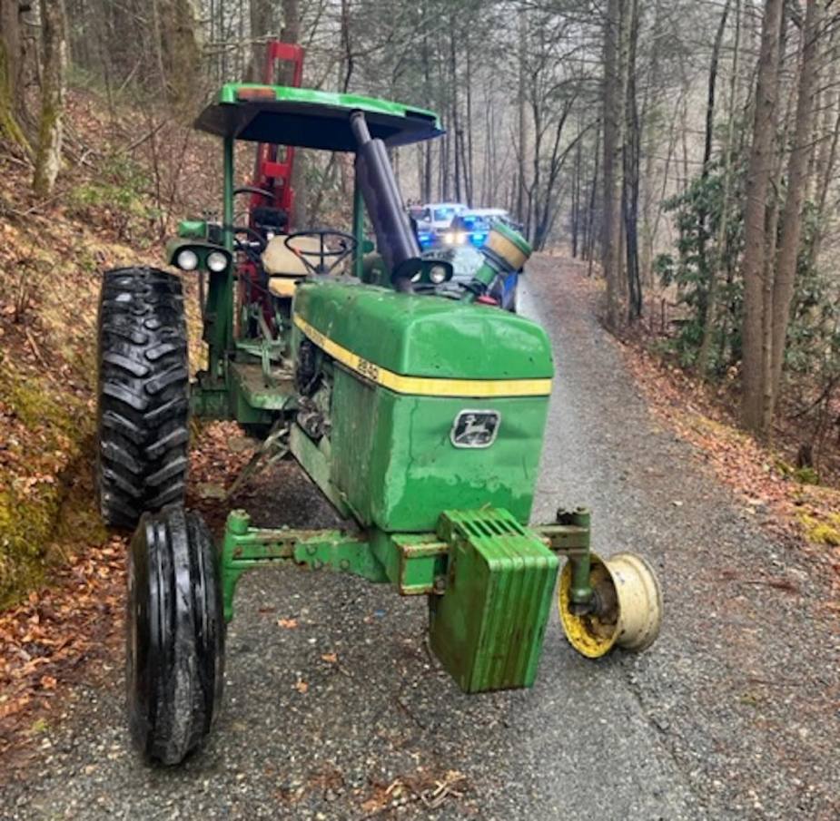 Stolen John Deere farm tractor with missing tire following chase by cops