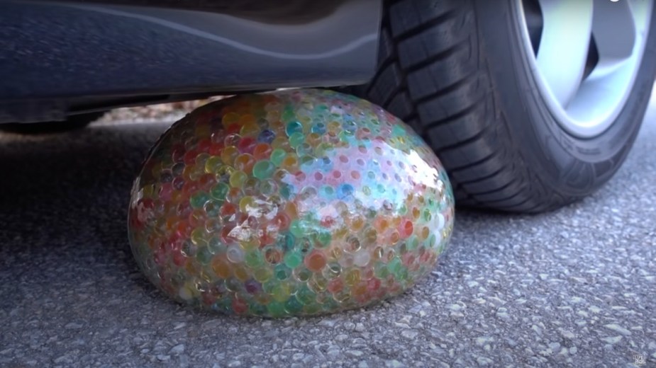 Tire runs over Orbeez water balloon in viral YouTube video of car crushing soft and crunchy things
