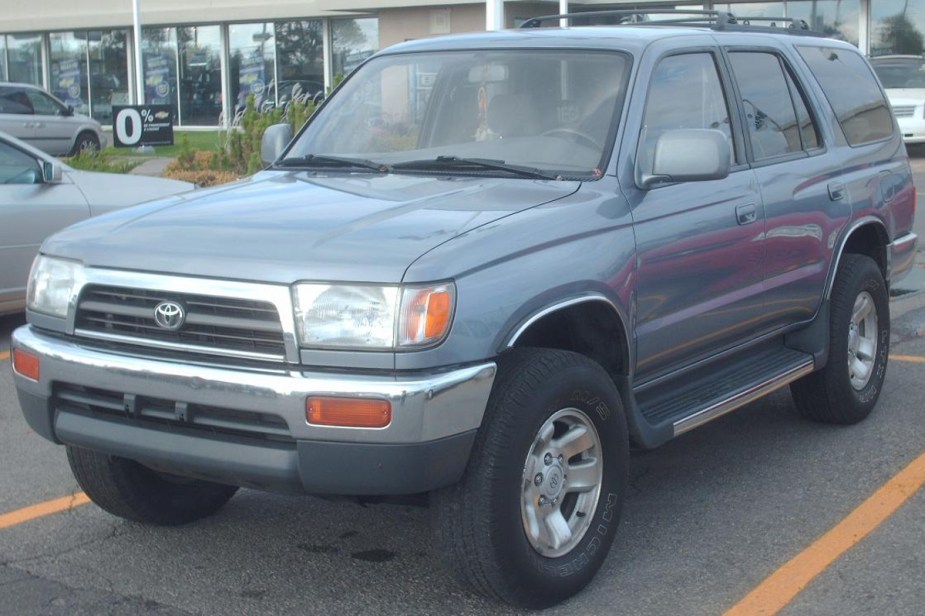 A 1996 Toyota 4Runner SUV sits in a parking lot. It is one of the most favored 4Runner models.