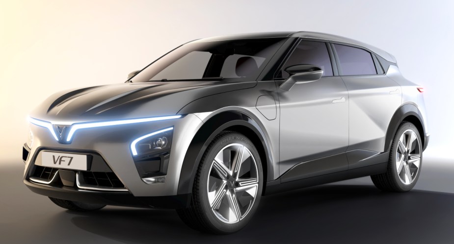 A gray VinFast VF 7 midsize electric SUV is parked. 