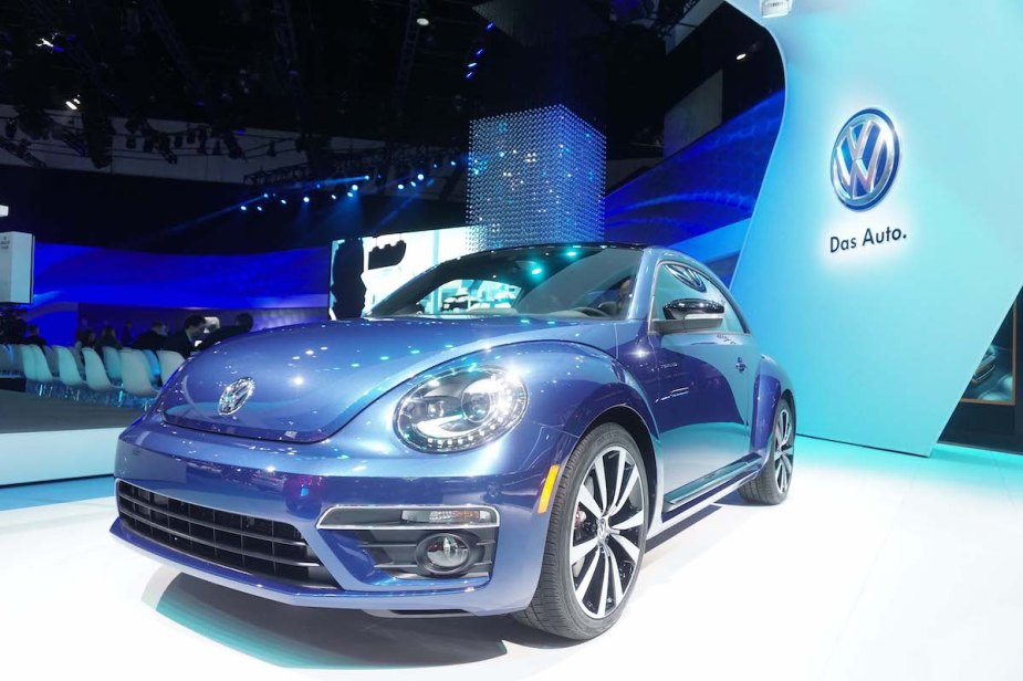 A blue Volkswagen Beetle, which is one of the most reliable Volkswagen models.
