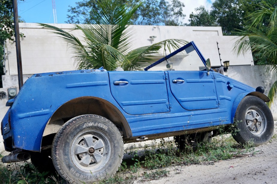 Closeup of a blue Volkswagen Safari built on a Beetle chassis as a military transport.
