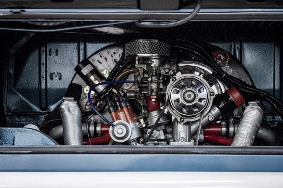 Closeup of the engine bay of a Volkswagen bus with its air cooled flat-four engine.