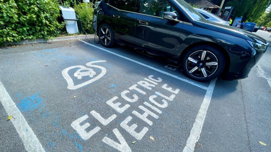An electric vehicle (EV) charging station parking spot at a car park in Bath, England