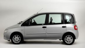 A side profile shot of a light gray 2009 Fiat Multipla model lacking the distinctive high headlights