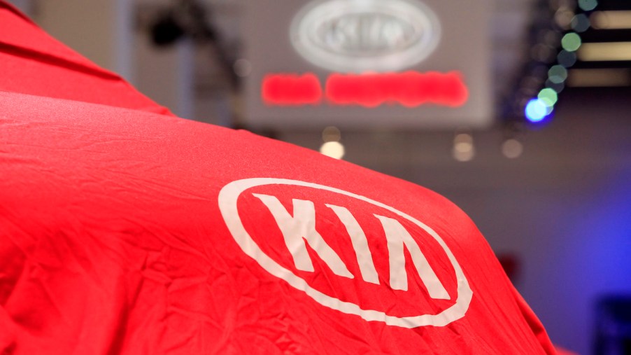 A Kia logo covering a car, which could be one of the most reliable Kia models.
