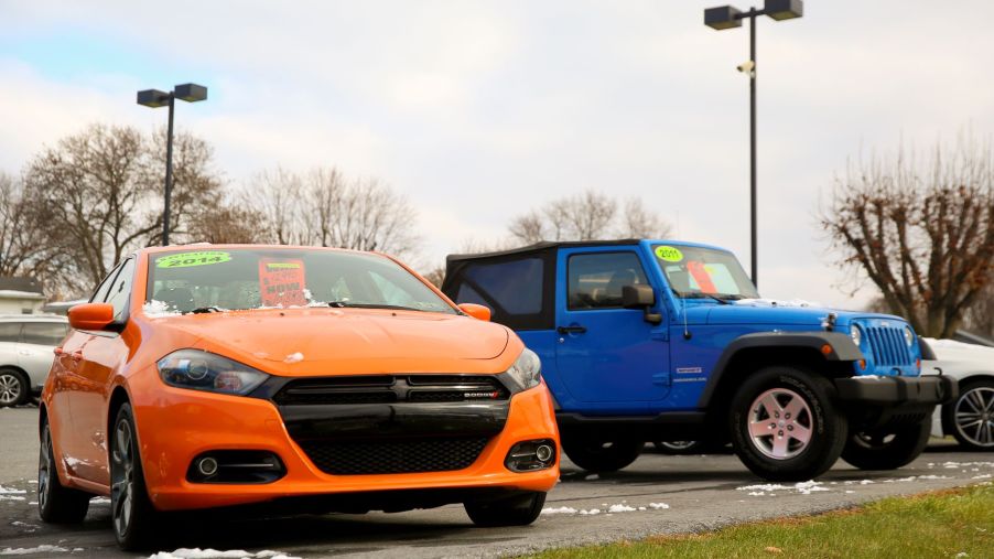 An orange used 2014 Dodge Dart compact sedan model for sale at the Eisenhauer Nissan dealership