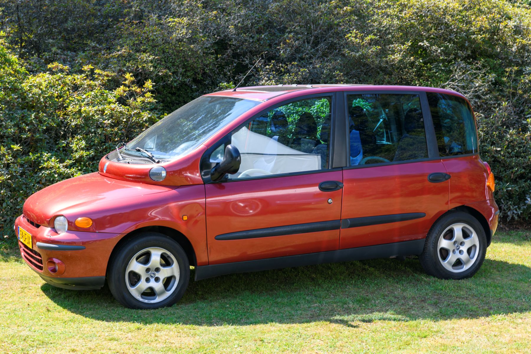 A red Fiat Multipla MPV model on display at the 2019 Concours d'Elegance at palace Soestdijk in Baarn, Netherlands