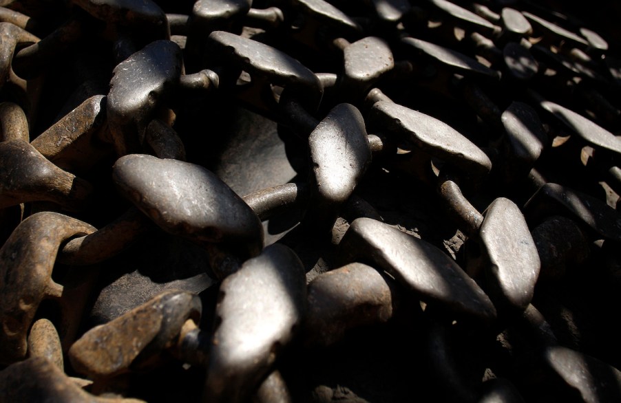 A set of tire chains on tires.