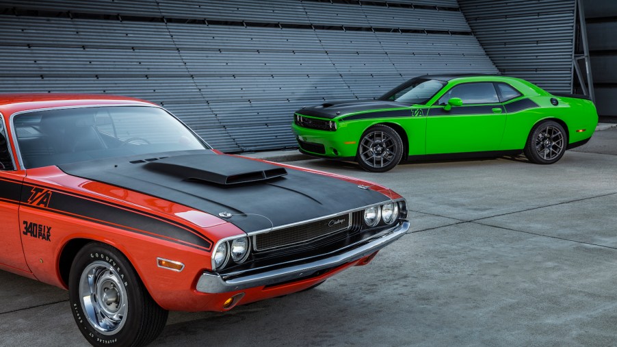 A red vintage Dodge Challenger is parked next to a new, green version of the T/A trim for a promo photo.