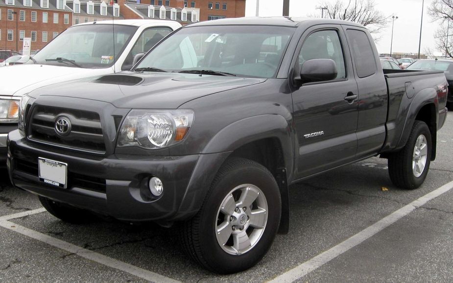 The 2009 Toyota Tacoma sits in a parking lot. It can be a used Tacoma for less than $15,000.