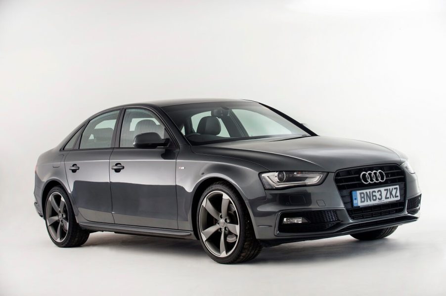 A used gray 2013 Audi A4 shows off its small car proportions and sleek LED lights.