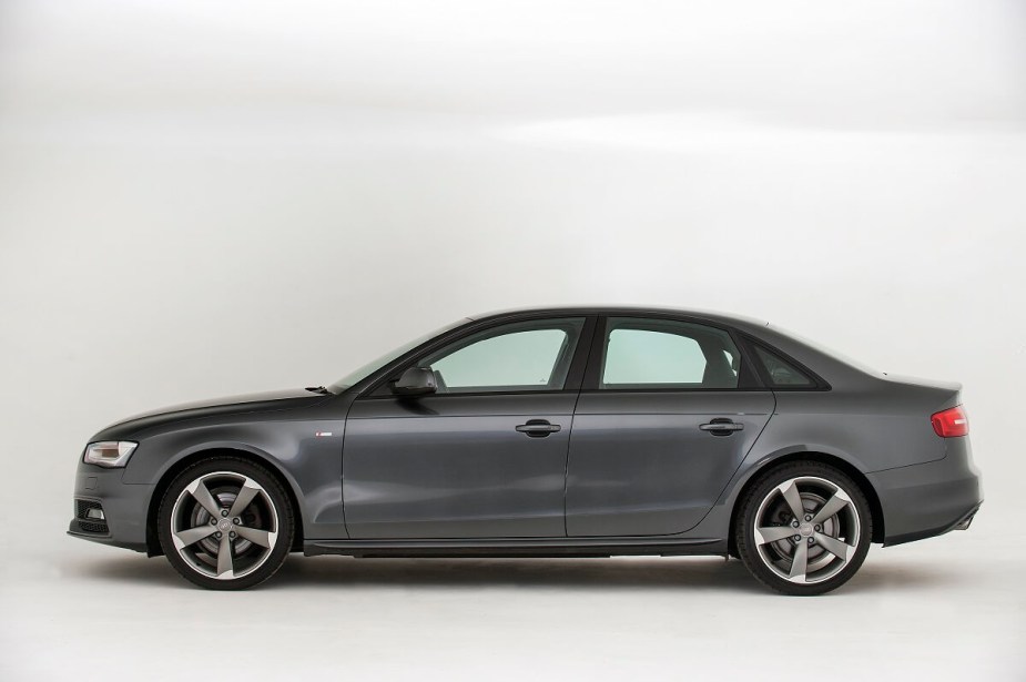 A gray 2013 Audi A4 shows off its side profile.