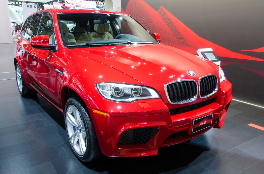 a red 2013 BMW X5, one of the used models to avoid buying